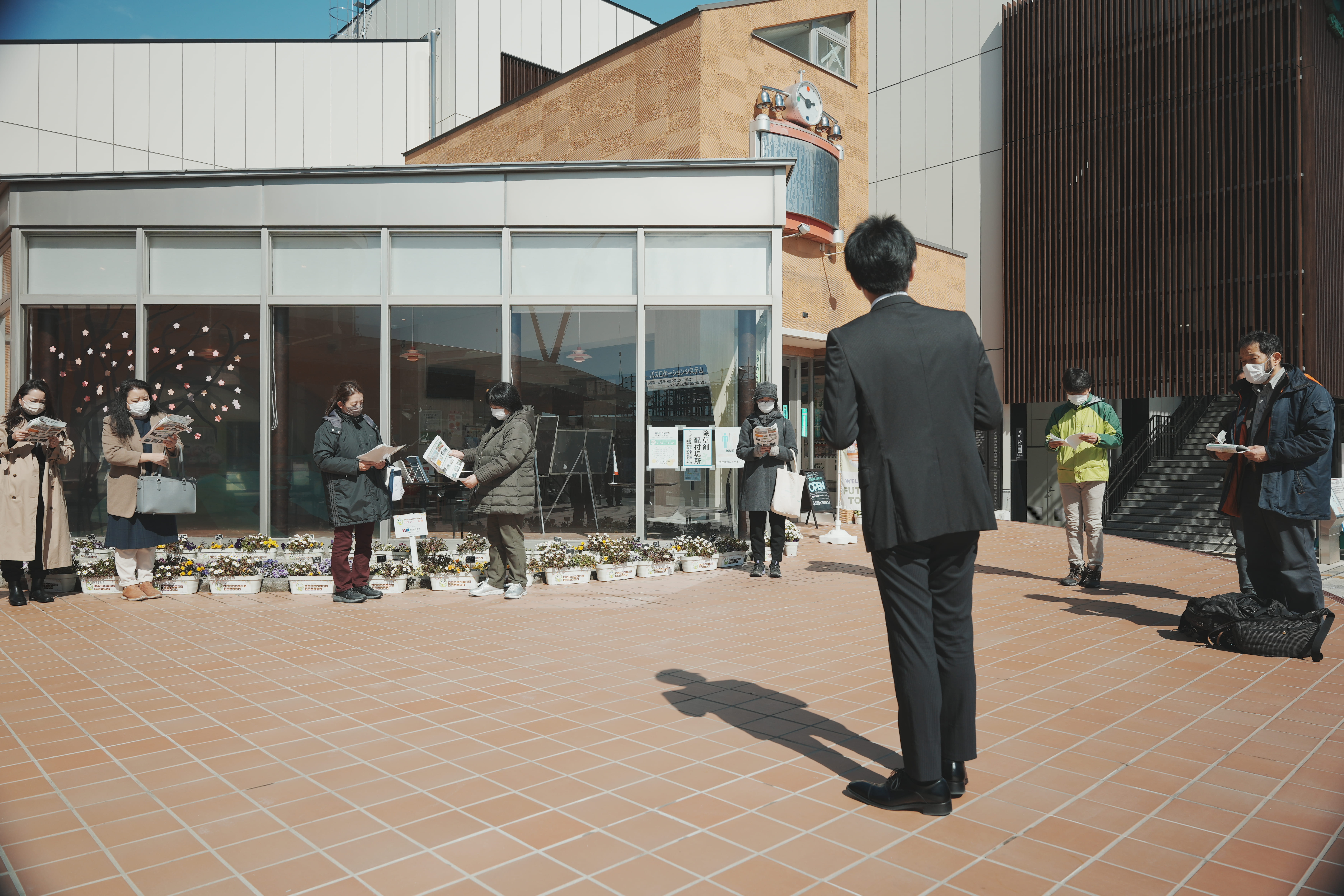 Listening to an explanation at Futaba Station