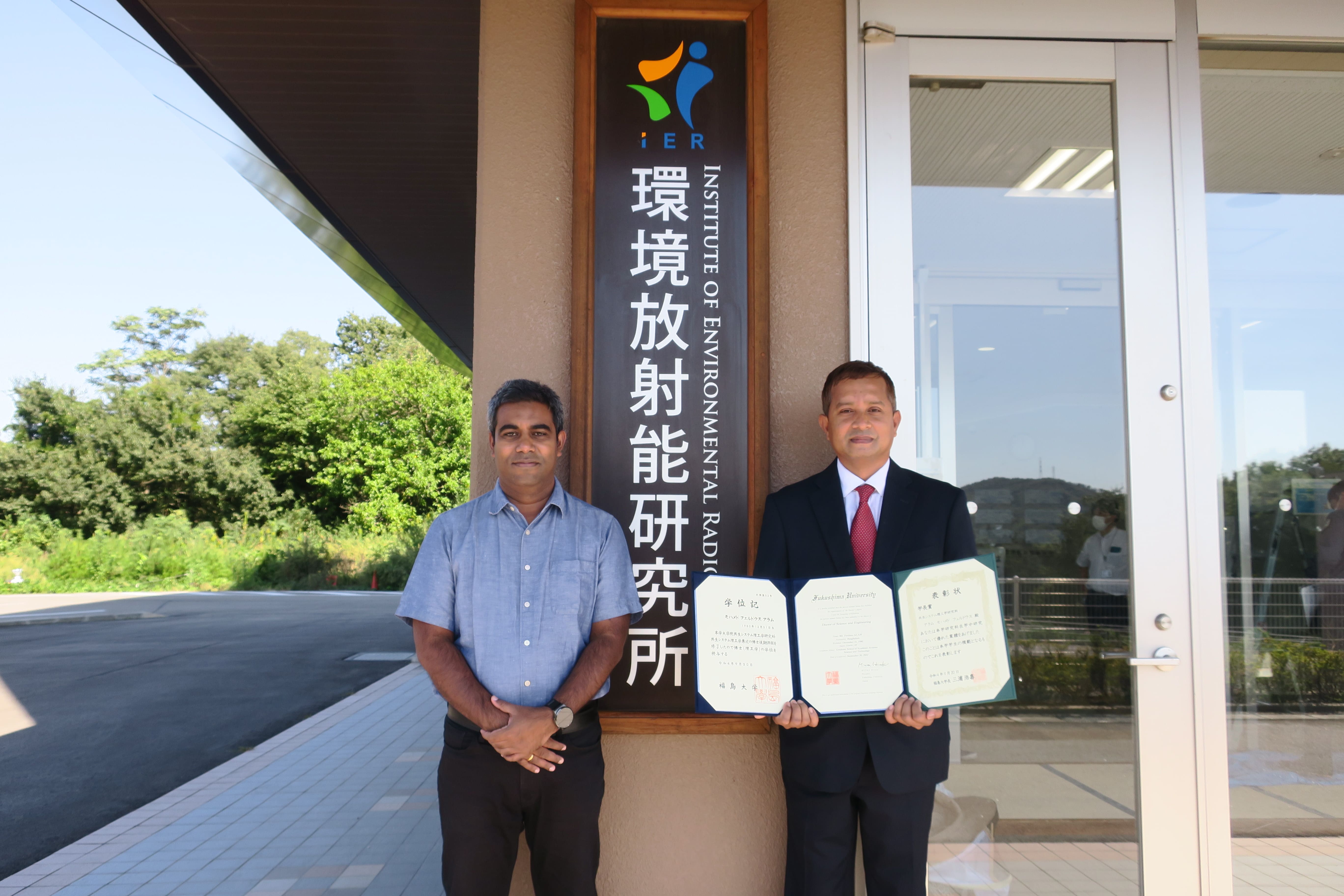 Associate Professor Rahman and Mr. Ferdous with his graduation certificates 